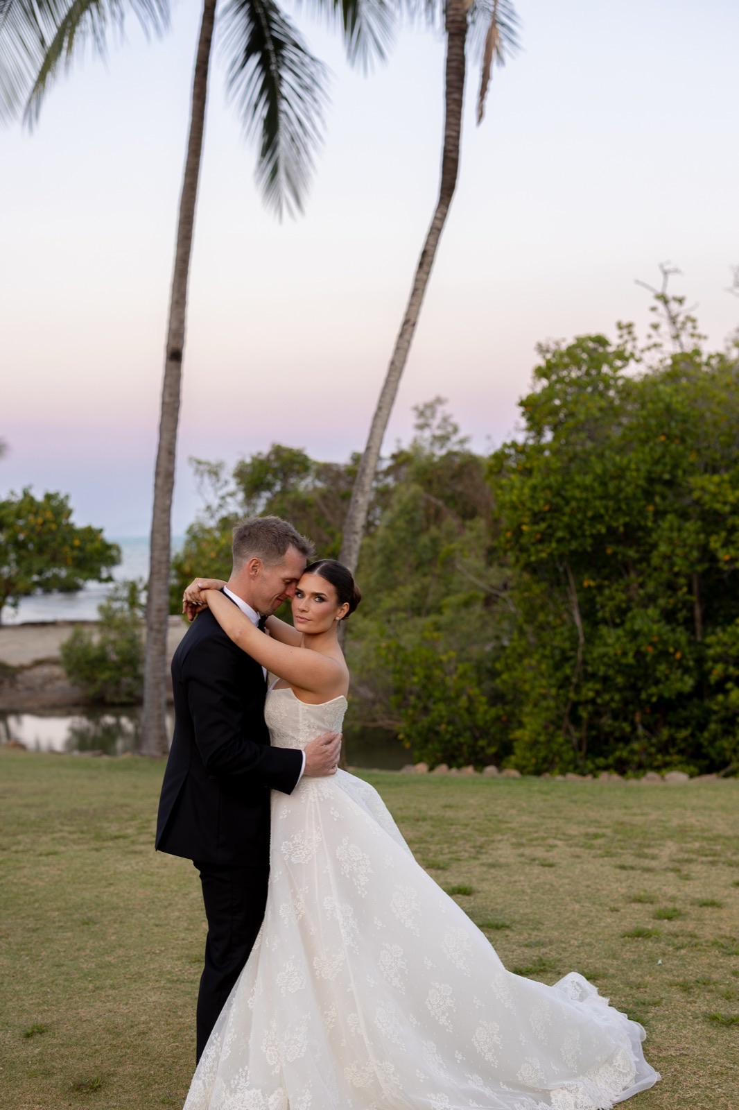 Couple — palm trees at dusk