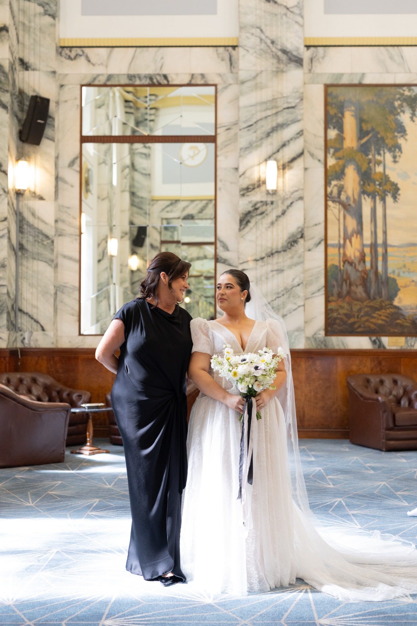 The bride with her mother in the marble lobby of Tattersall's Club, Brisbane