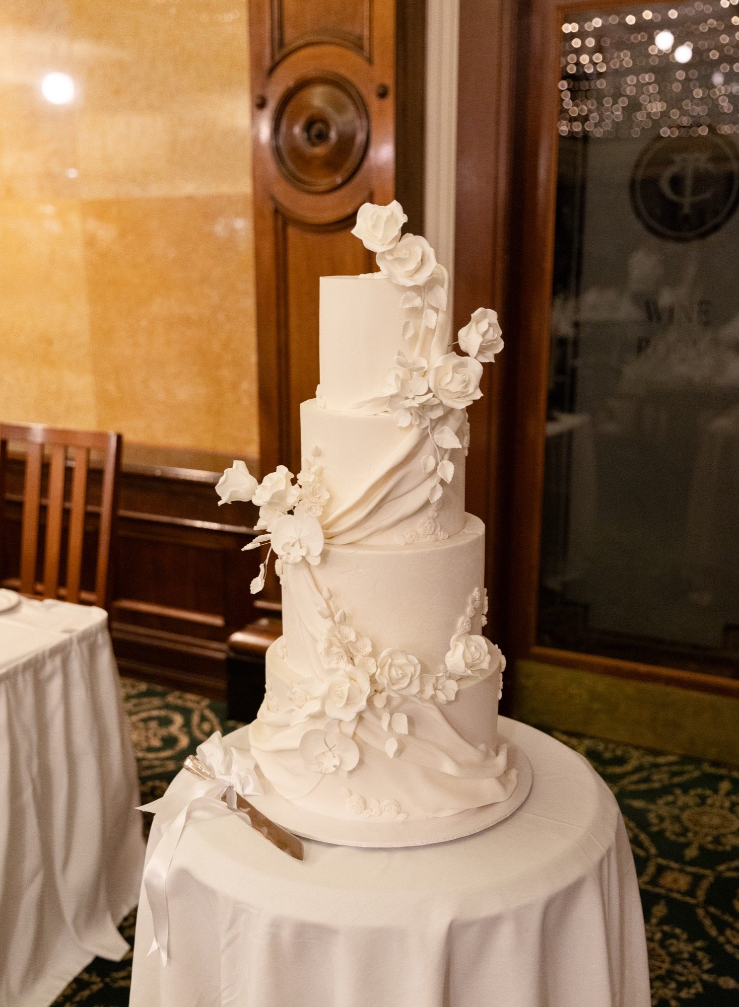 Four-tier white wedding cake with sugar roses and orchids, Tattersall's Club Brisbane