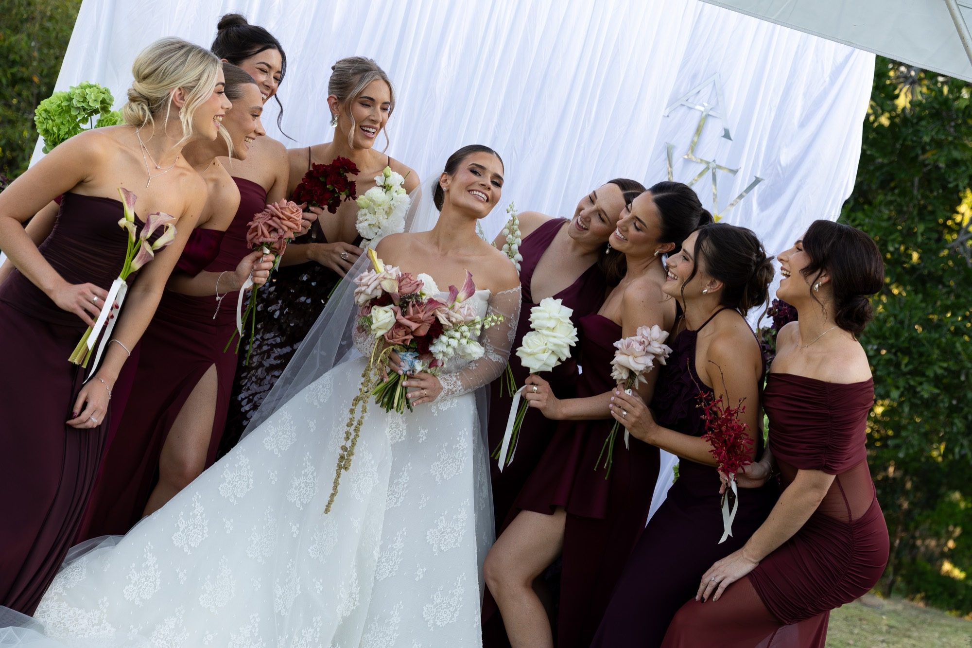 Jessica & Everett — the bride laughing with her bridesmaids, Freedom Shores, Airlie Beach